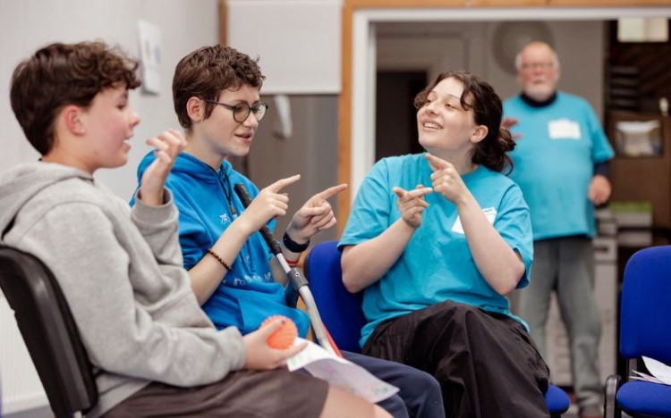 Participants and a facilitator during one of our weekly drama sessions for Disabled young people.